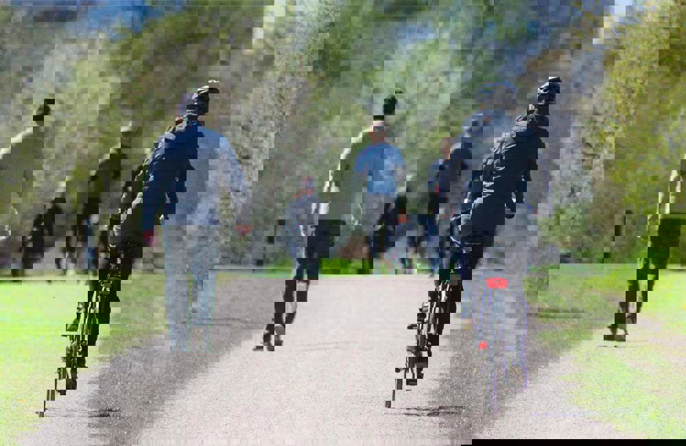 People walking and cycling along a path