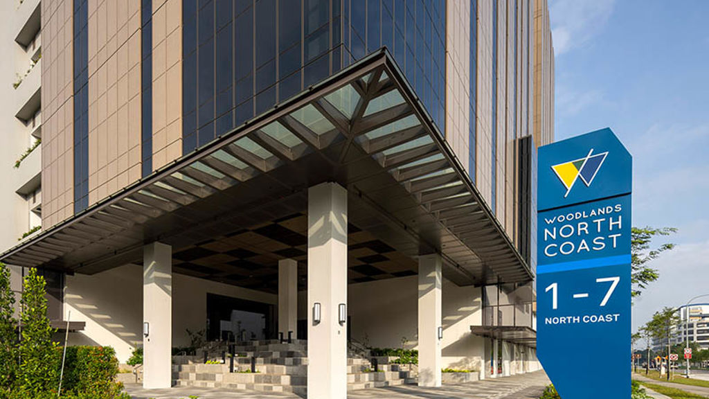 The corner entrance to a building in the Woodlands North Coast precinct
