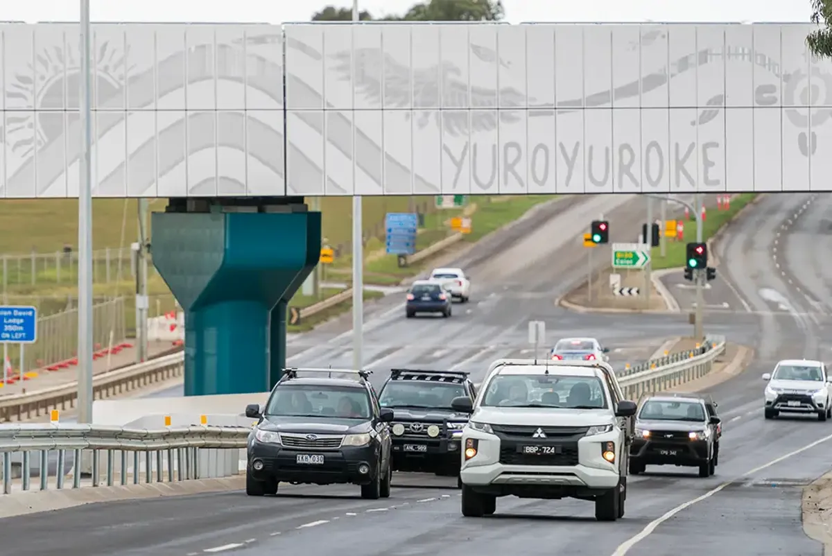 First Nations artwork on bridge above lanes of traffic