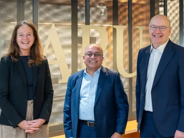 Hilde Tonne, Mahadev Raman and Jerome Frost OBE standing together