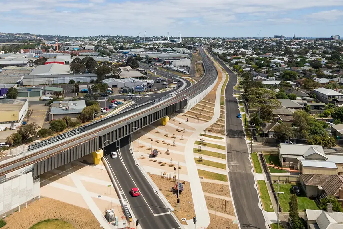 A high angle view of an elevated rail line in the suburbs
